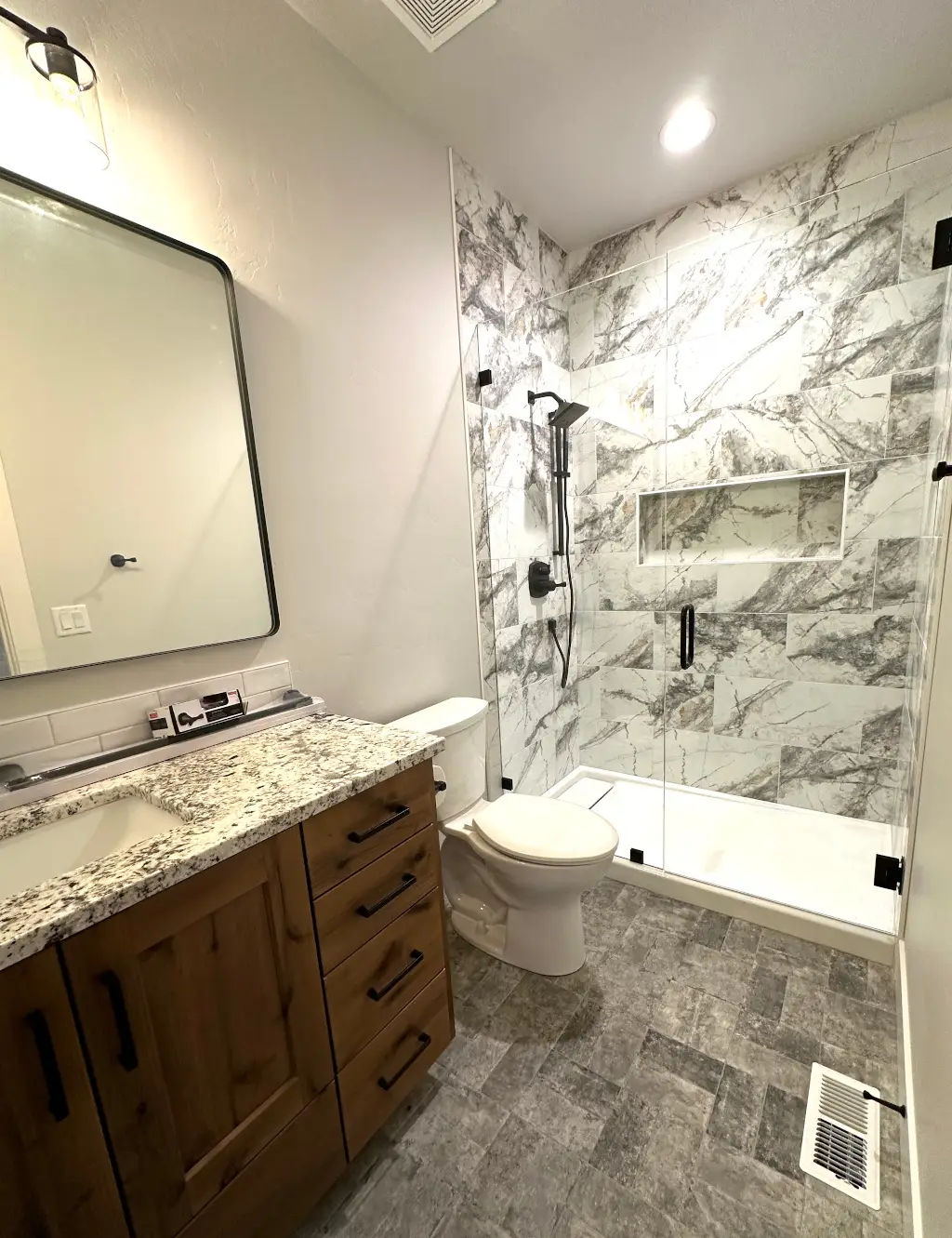 Primary bathroom with large-format tile and double vanity
