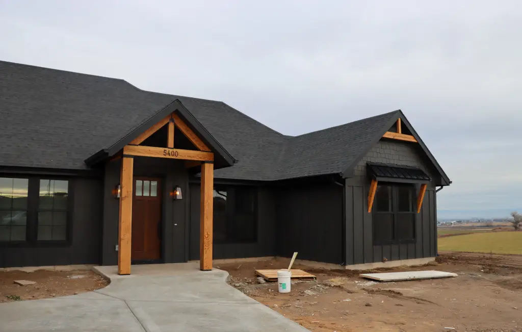 Side elevation showing garage and clean roofline