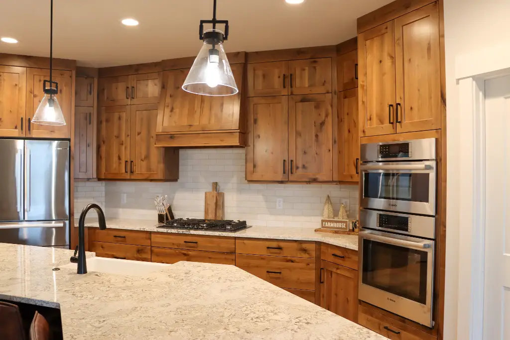 Kitchen — refrigerator wall and full-height cabinetry