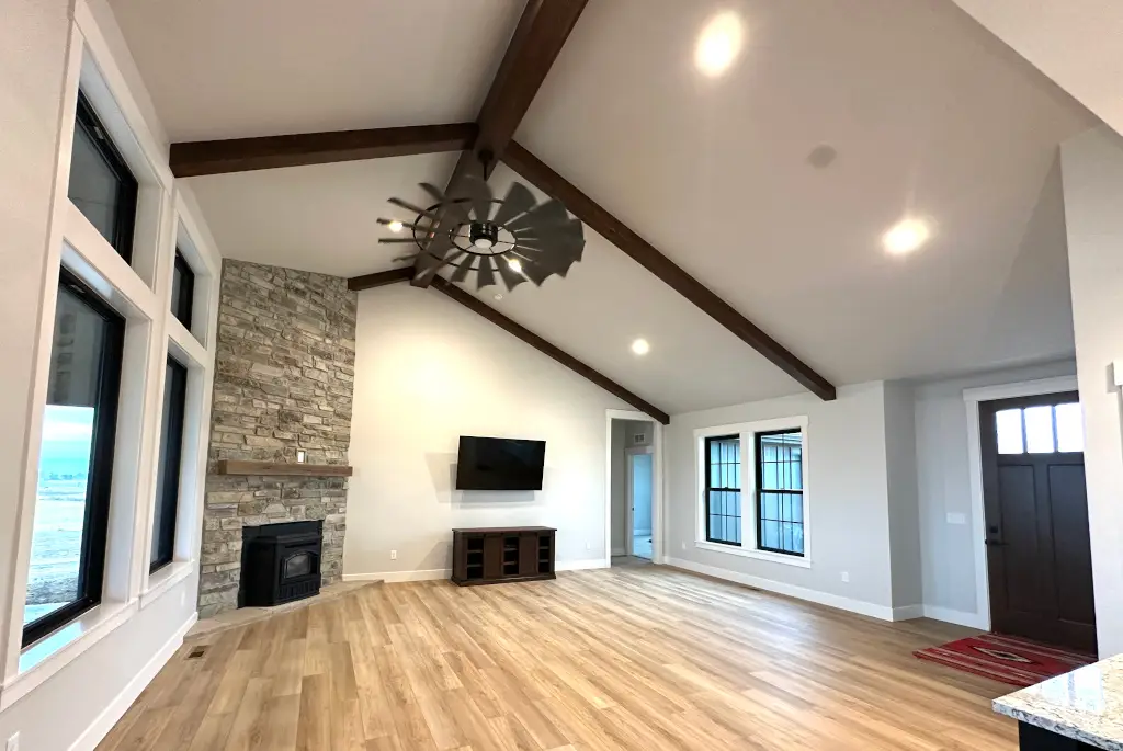 Great room with stone fireplace surround